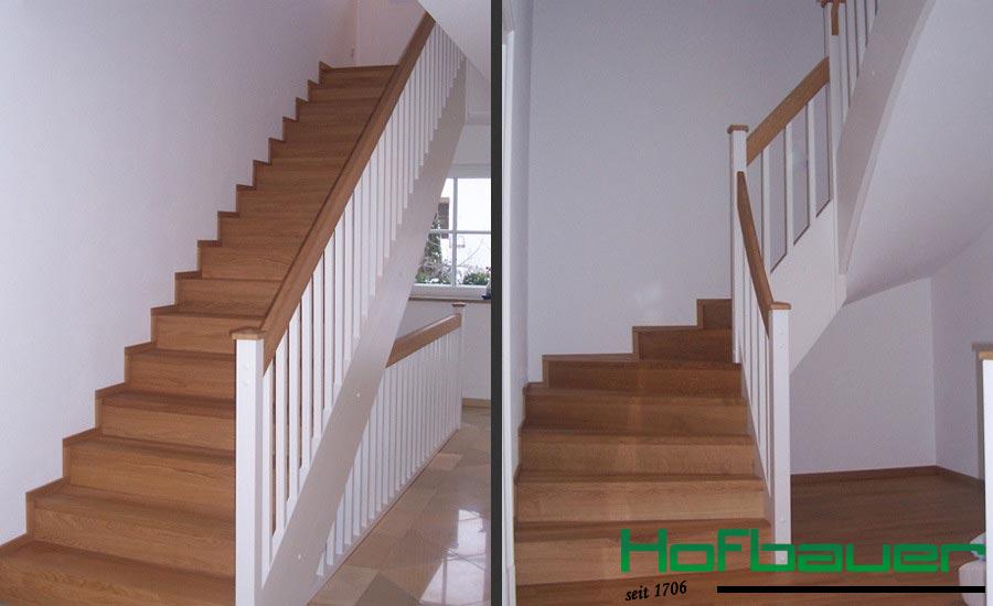 Betontreppe verkleidet mit hellbraunem Holz und weißem Treppengeländer