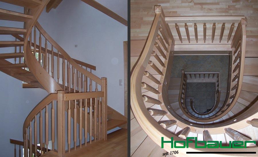 Spindeltreppe mit Handlauf aus hellem Holz und entsprechendem Geländer